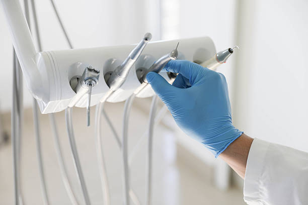 Professional Tooth Extraction technician working in University Park, NM